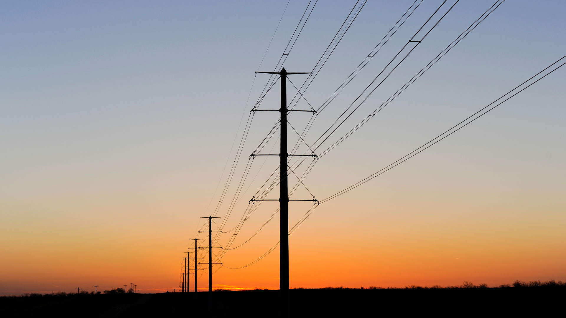 Electric transmission corridor at sunset.