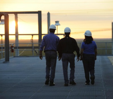 Engineers walking in a sunset